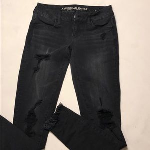 Black ripped American Eagle jeggings.